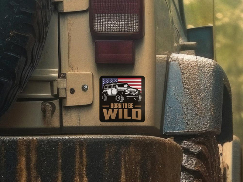 Born to be Wild patriotic Jeep sticker with American flag background and bold text.