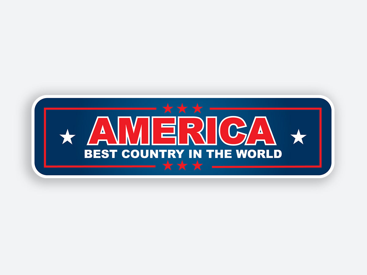 A rectangular patriotic sticker with a bold red, white, and blue color scheme. The text reads “AMERICA” in large red letters, followed by “BEST COUNTRY IN THE WORLD” in smaller white letters. The design is framed by stars and red borders, giving it a classic, patriotic look.