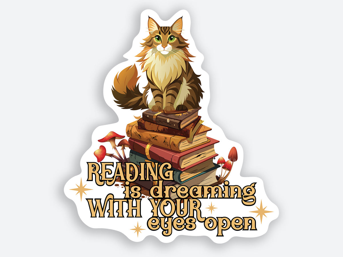 Cat sitting on a stack of books with the text “Reading is dreaming with your eyes open.” High-quality sticker.